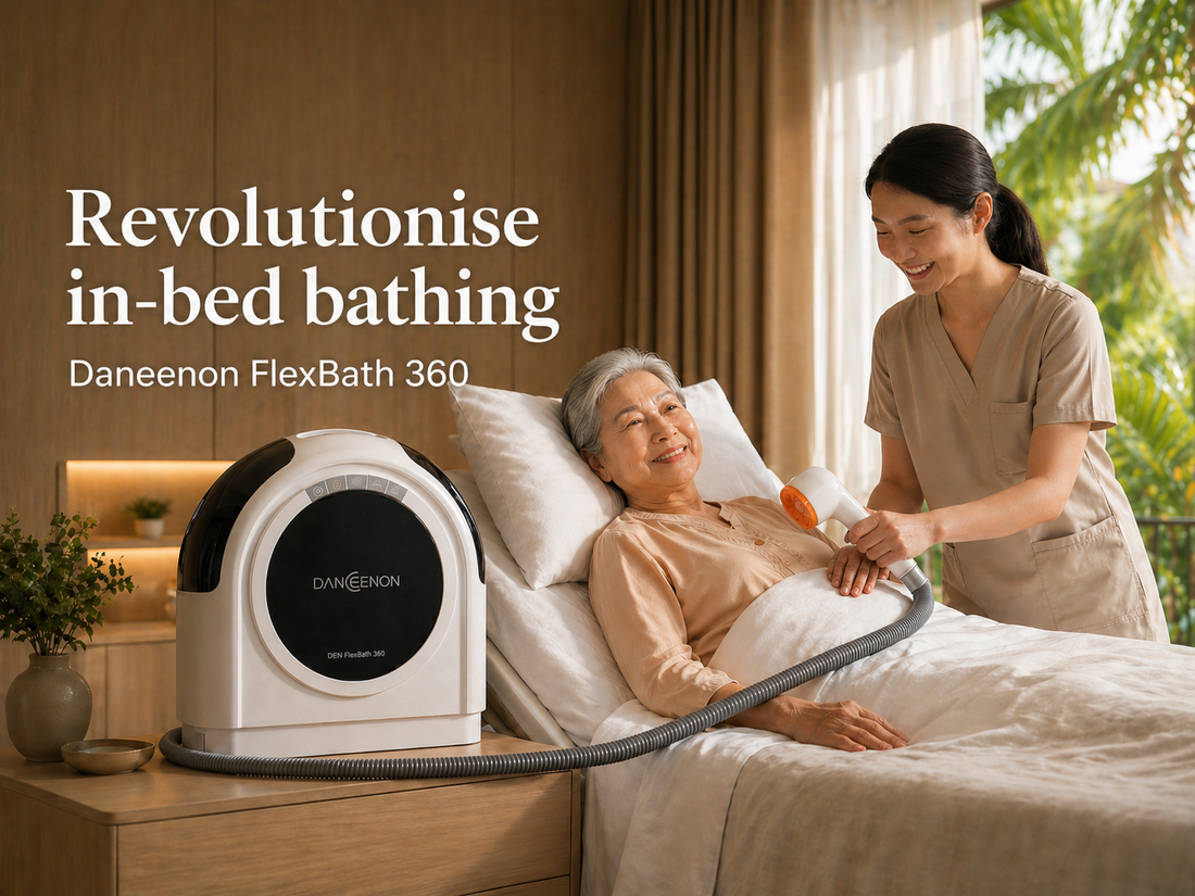 Nurse using the Daneeon FlexBath 360 Portable Bathing Unit on an elderly senior on a hospital bed in Singapore